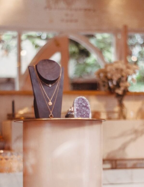 Chic jewelry display with elegant necklaces in a stylish boutique setting.
